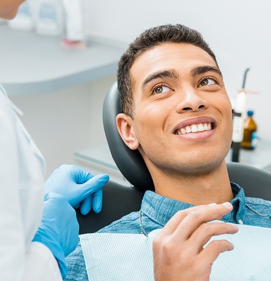 Smiling man in dental chair during dental checkup