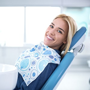 Smiling woman sitting in dental office